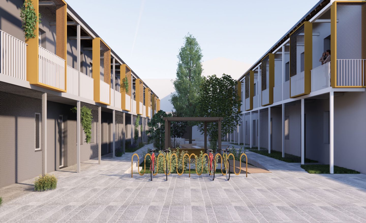 Vista di progetto del complesso residenziale di Legnano, con corte interna, portabiciclette e ballatoi con cornici gialle